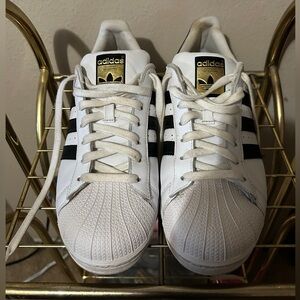 Adidas White Superstar black stripe gold accents